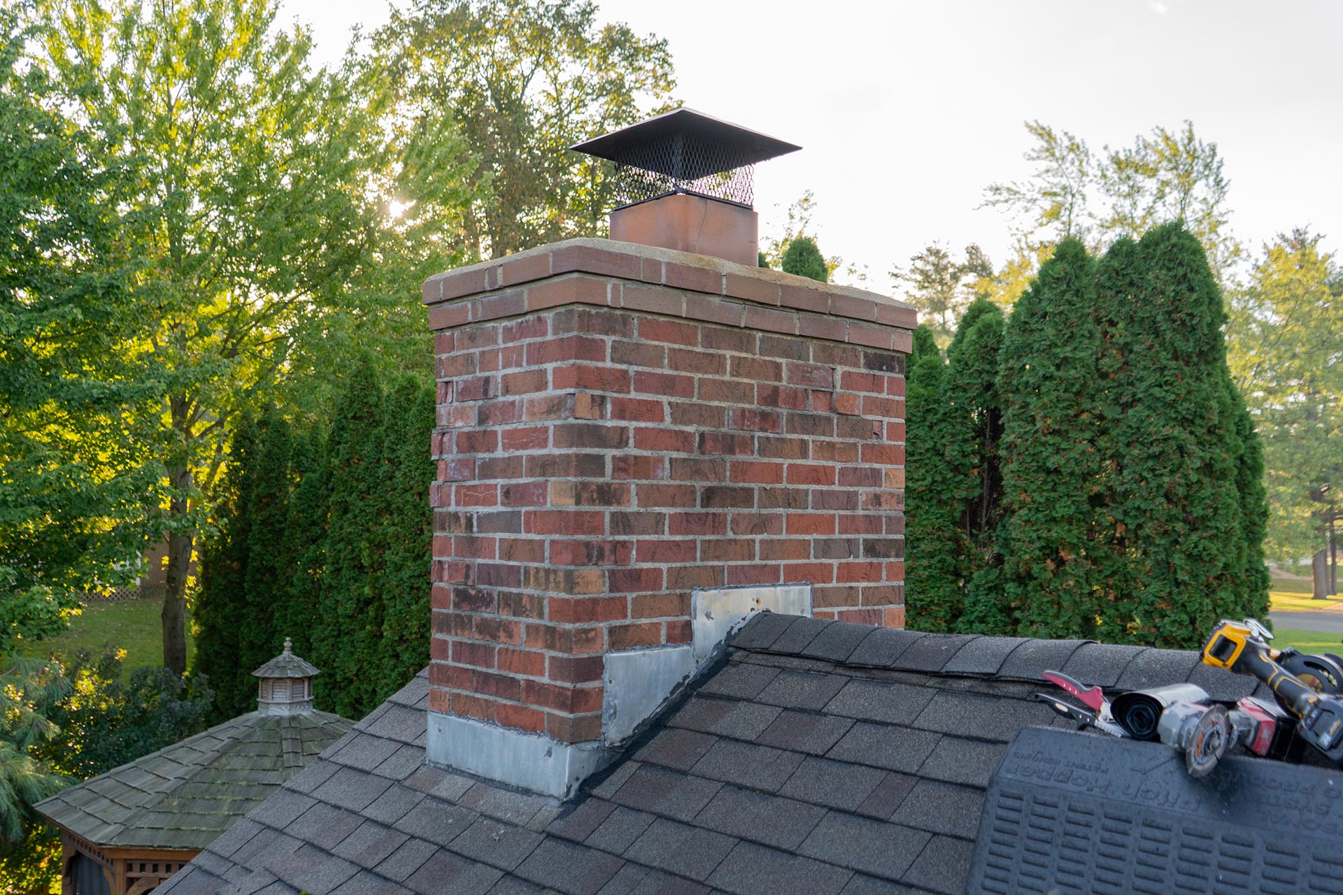 Before chimney repair, where four other roofers had failed to prevent leaks.